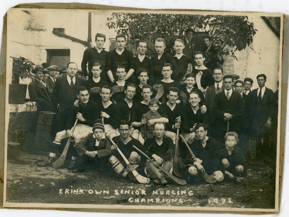 Charles Brady at 20. Middle row, behind the man with a son