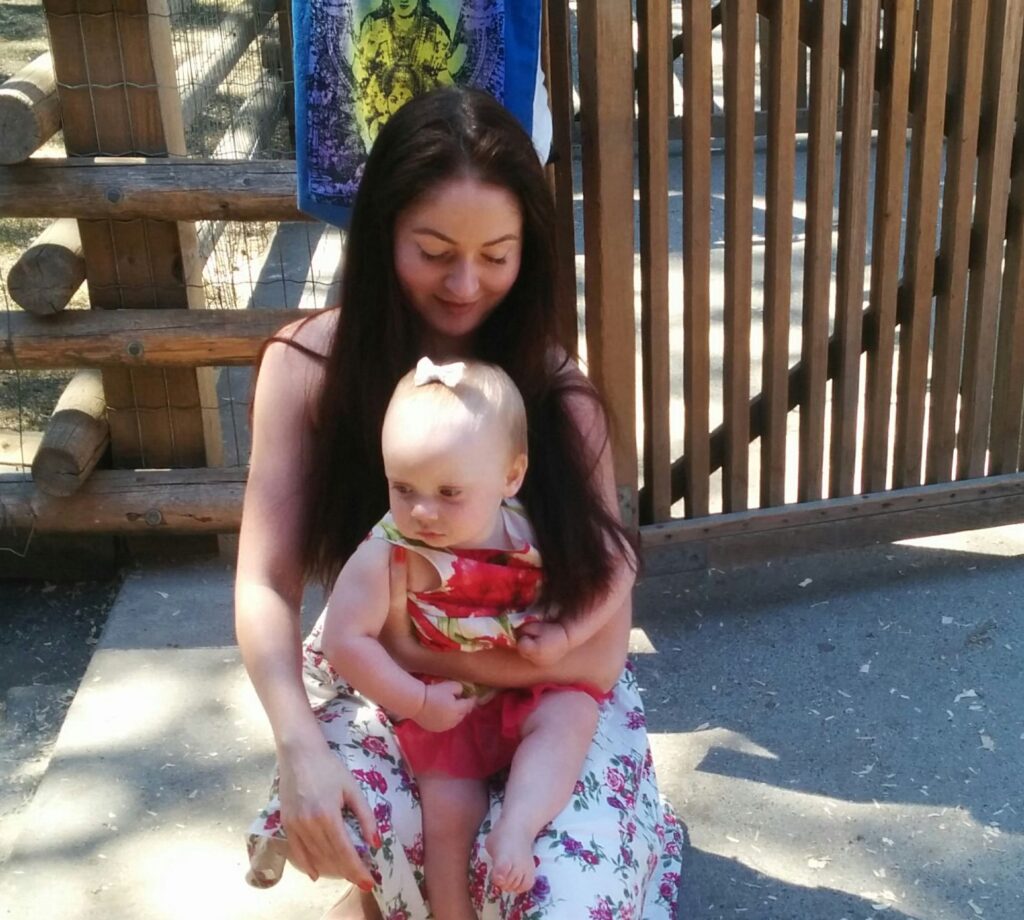 Photo of Christine and baby Elizabeth at Petting Zoo, Victoria. 2015.