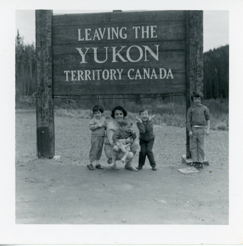 Family Photo Yukon Territories Sign Bw Photo by Bill of his family under signage leaving Yukon 1964