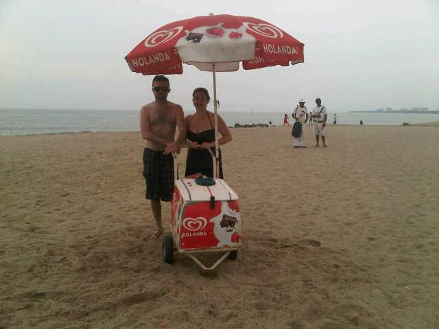 Melissa and Shane posing with an ice cream cart, remembering where it all began. Cancun, Mexico. January 2012